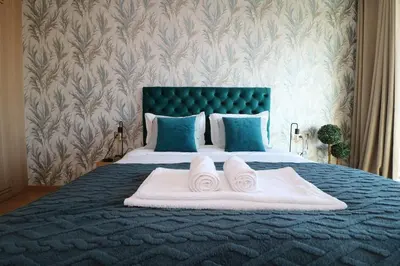 a bedroom with a bed with two towels on it at Studio luxueux sur Val d'anfa in Casablanca