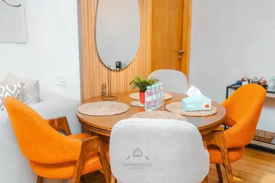 a dining room with a table with chairs and a mirror at TheBesty Ocean Apartment 2MBd- By Appart'Ayla in Casablanca