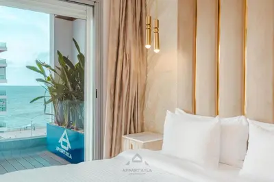 a bedroom with a bed with a view of the ocean at TheBesty Ocean Apartment 2MBd- By Appart'Ayla in Casablanca