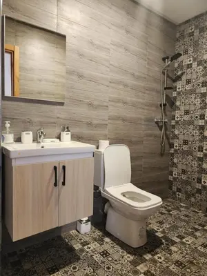 a bathroom with a toilet and a sink and a shower at Bab fes Appartement 2 pièces à Aïn Sebaâ Casablanca in Aïn Sebaa
