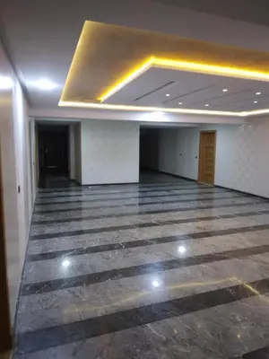 a large empty room with ailed floor and a ceiling at Bab fes Appartement 2 pièces à Aïn Sebaâ Casablanca in Aïn Sebaa