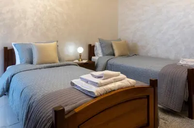 a room with two beds with towels on a table at Charmant et cosy appartement en plein centre ville in Casablanca