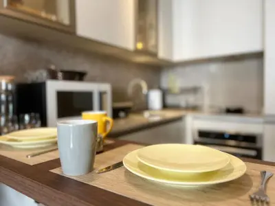 a table with plates and a cup on a kitchen counter at Rafina in Casablanca