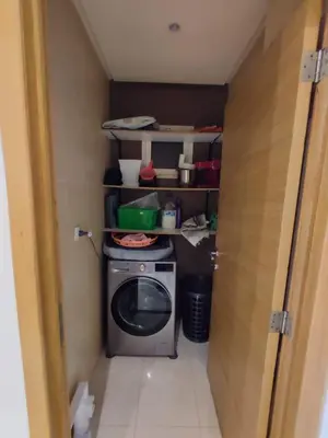 a small kitchen with a washing machine in a room at Wifak beach rental in Temara