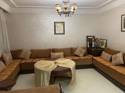 a living room with a couch with a bow on it at The White House in Casablanca