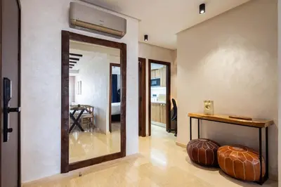 a living room with a mirror and a table at Central Cosy 2BR 2 Baths, Balcony & Clear View in Casablanca