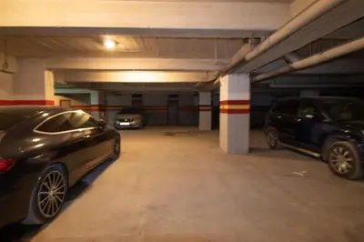 a parking garage with two cars parked in it at good Nice appartement in Casablanca