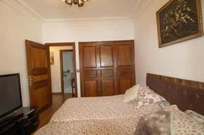 a bedroom with a bed and a flat screen tv at good Nice appartement in Casablanca