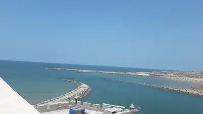 a view of a body of water with a beach at Apartment with sea view in El Harhoura