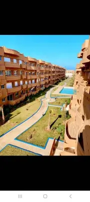 an aerial view of an apartment complex with a pool at Appartement de luxe avec piscine à Mansouria in Mansouria