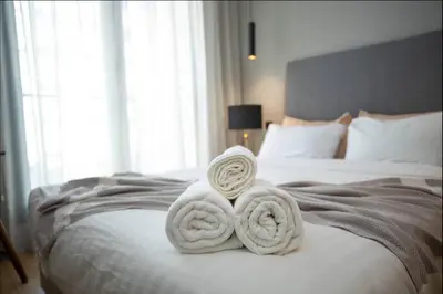 a bed with two towels on top of it at Where to stay in Casablanca 2 bedrooms in Casablanca
