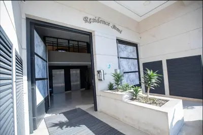 an entrance to a building with a door and plants at Where to stay in Casablanca 2 bedrooms in Casablanca