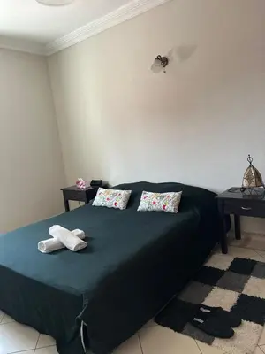 a bedroom with a bed with two towels on it at Un agréable studio au quartier Maarif à Casablanca in Casablanca