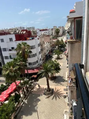 an overhead view of a city with palm trees and buildings at Un agréable studio au quartier Maarif à Casablanca in Casablanca