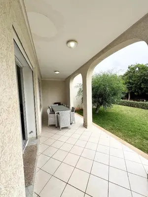 a patio with a table and chairs on it at Coastal serenity oasis in El Jadida