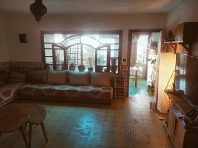 a living room with a couch and a table at Birds House in Casablanca
