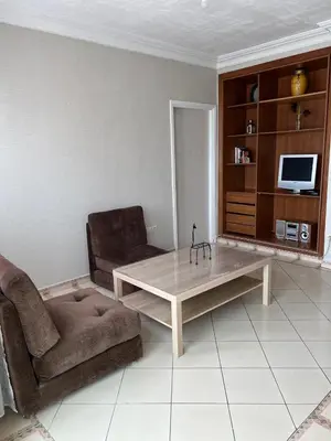 a living room with a couch and a coffee table at Un studio meublé agréable à Casablanca in Casablanca