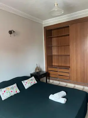 a bedroom with a bed with two pillows on it at Un studio meublé agréable à Casablanca in Casablanca