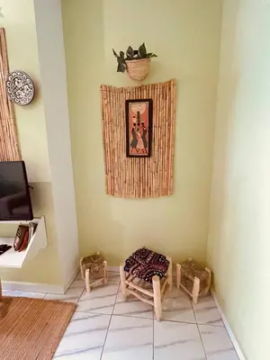 a corner of a room with a chair and a basket on the wall at Cozy Studio in Casablanca in Casablanca