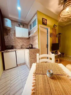 a kitchen and dining room with a table in a room at Cozy Studio in Casablanca in Casablanca