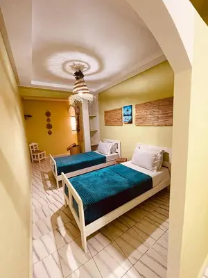a bedroom with two beds in a room at Cozy Studio in Casablanca in Casablanca