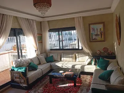 a living room with a couch and a table at La corniche in Casablanca