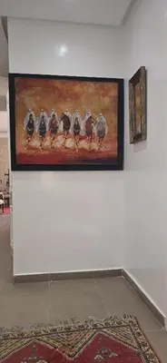 a painting of five birds on a wall at La corniche in Casablanca