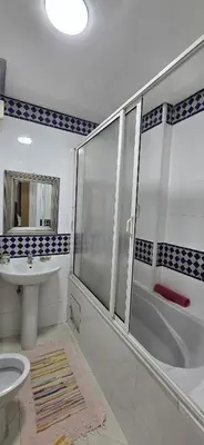 a bathroom with a shower and a toilet and a sink at La corniche in Casablanca