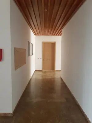 an empty room with white walls and a wooden ceiling at Luxury apartment in Hay Riad, Prestigia, Rabat in Rabat
