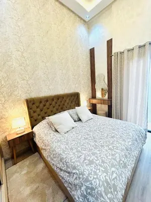 a bedroom with a large bed and a window at Casablanca Luxury Studio Apartment Steps to the Beach in Casablanca