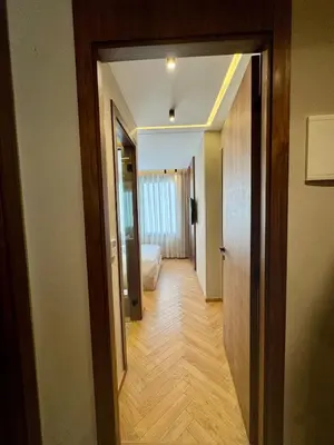 a hallway with a door leading to a bedroom at CYPRessa Loft - Nature and Serenity - Corniche Access in Casablanca