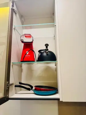 a cupboard with a pot and a tea kettle at CYPRessa Loft - Nature and Serenity - Corniche Access in Casablanca