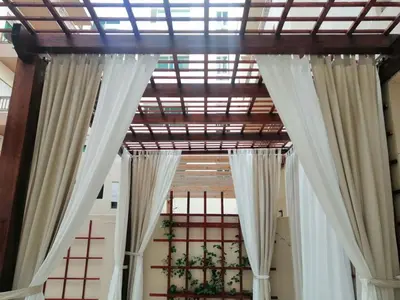 a ceiling with white curtains in a room at Cozy Appartement Relax in Mohammedia
