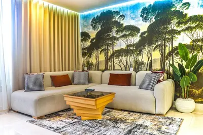 a living room with a couch and a coffee table at Studio de luxe Vue Mer corniche casablanca in Casablanca