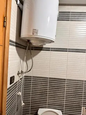 a bathroom with a toilet with a water tank at Casa fbelvedère in Casablanca