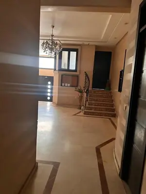 a hallway with a chandelier and stairs in a building at Casa fbelvedère in Casablanca