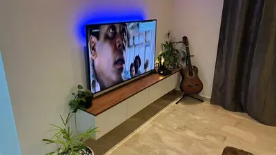 a living room with a flat screen tv on a wall at Garden Bay Luxe, Tamaris Bord de Mer in Casablanca
