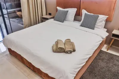 a bedroom with a bed with two bags on it at Studio de charme face corniche de Casablanca in Casablanca