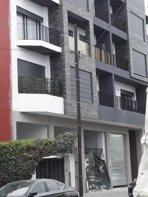 a car parked in front of a building at Luxe Ghandi Casablanca in Casablanca