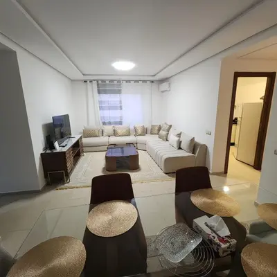 a living room with a couch and some chairs at Diana Ennour in Rabat