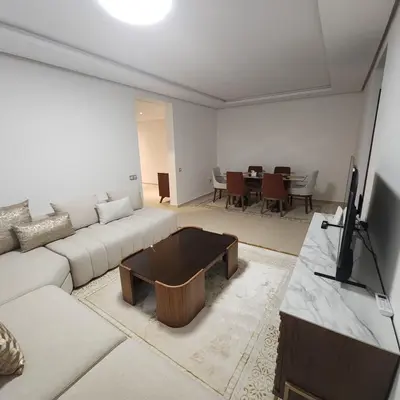 a living room with a couch and a table at Diana Ennour in Rabat