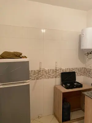 a kitchen with a stove and a counter top at Appartement à Skhirat in Skhirat