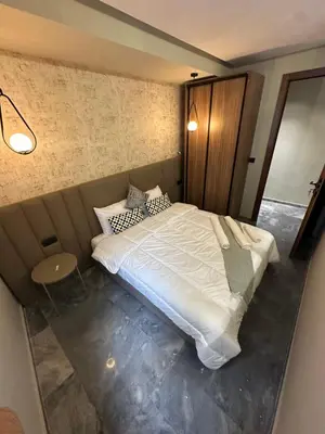 a bedroom with a large white bed in it at Joli appartement a casablanca in Casablanca