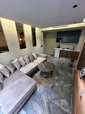 a living room with a couch and a table at Joli appartement a casablanca in Casablanca