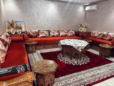 a living room with a couch and a table at Elegant & spacious with a view in Mansouria