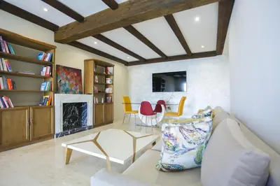 a living room with a couch and a fireplace at Terrasse au Soleil, Confort in Bouskoura