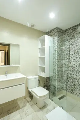 a bathroom with a toilet and a sink and a shower at Terrasse au Soleil, Confort in Bouskoura