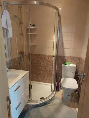 a bathroom with a shower and a toilet and a sink at Casabay T4 Sidi Rahal Vacation apartment in Sidi Rahal
