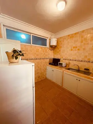a kitchen with a white refrigerator and a sink at Attractive Studio in Casablanca in Casablanca