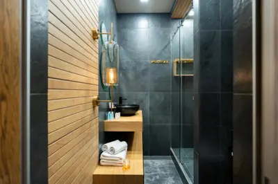 a bathroom with a shower with a glass door at charcho place in Les Camps
